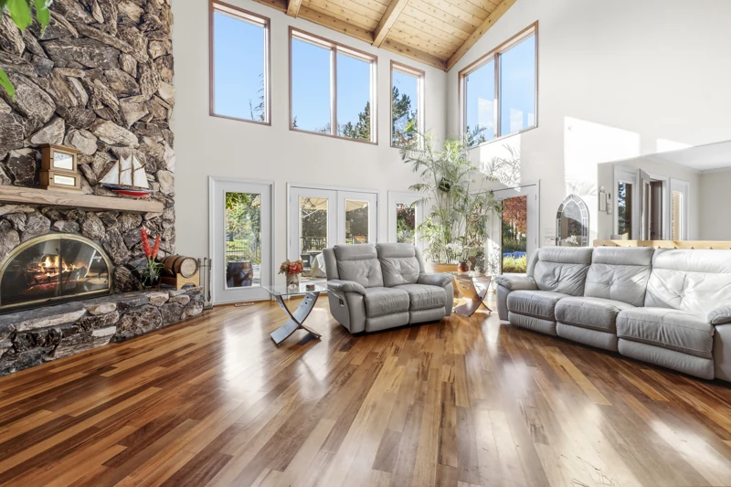 Great room windows and stone fireplace