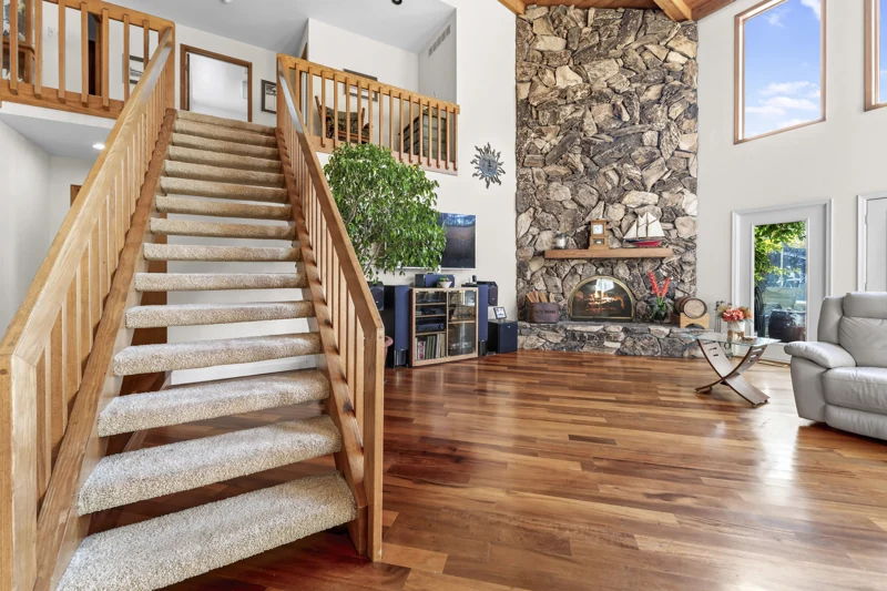 Oak staircase and stone fireplace